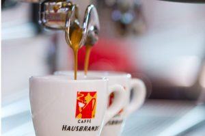 White coffee cup with hausbrandt brand logo