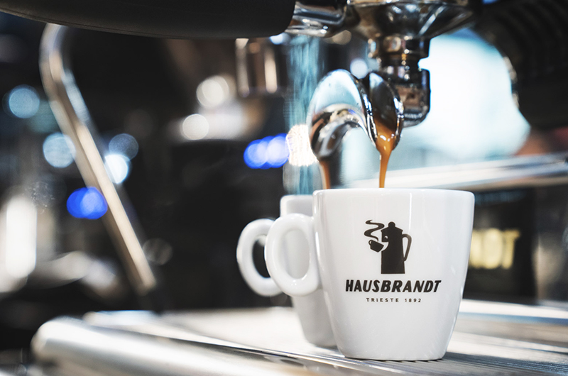white coffee cup with hausbrandt brand logo
